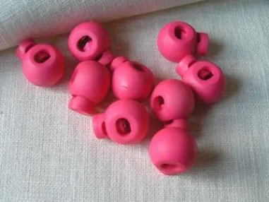 Knopen - Koordstopper rond fuchsia*